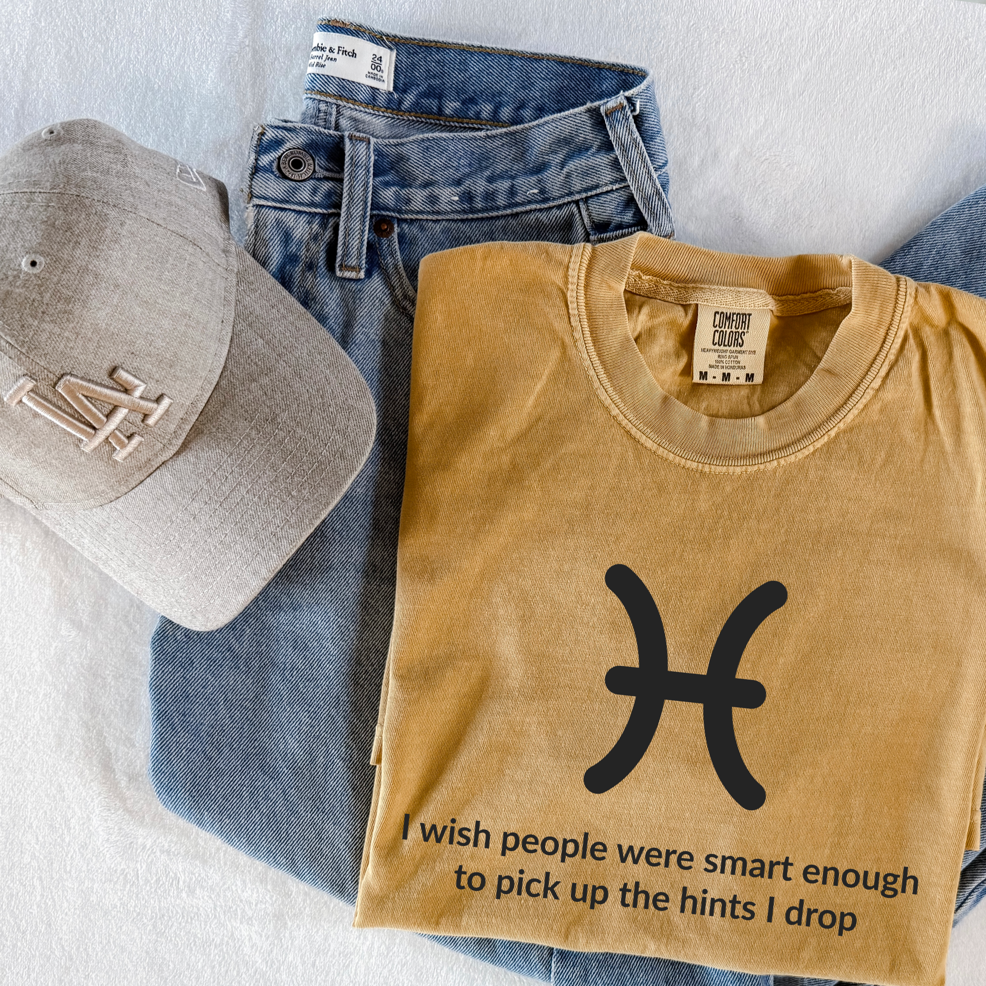 Funny Pisces zodiac horoscope shirt featuring “I Wish People Were Smart Enough to Pick Up the Hints I Drop.” Unique astrology gift for Pisces birthdays and water sign horoscope fans.