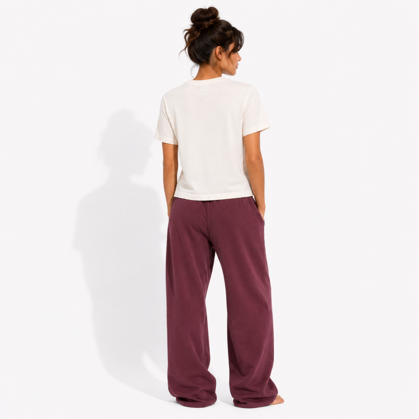 Back view of a women's washed garment-dyed t-shirt showing the relaxed fit and clean back while wearing the Smutsville University Good Girl Major graphic tee.