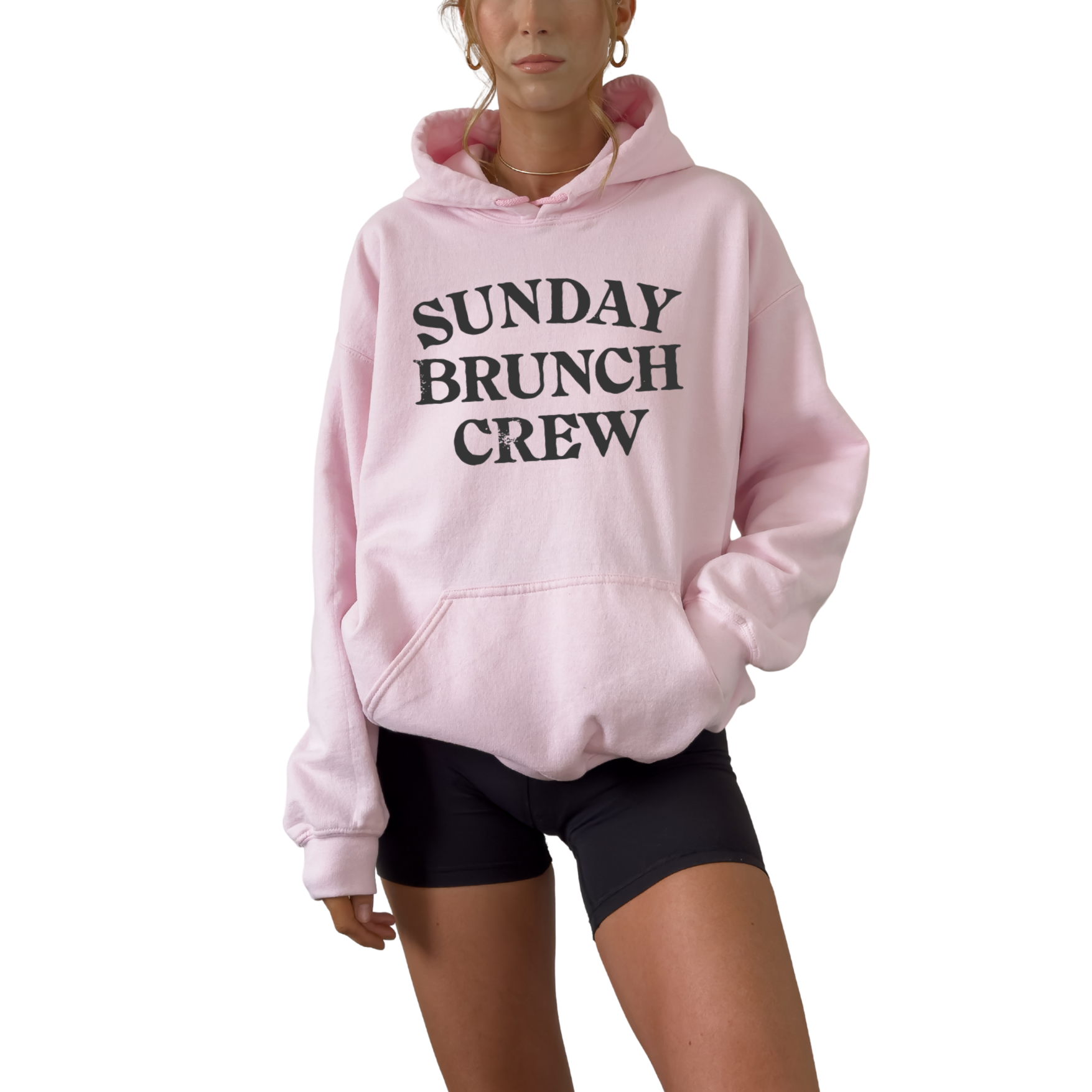Unisex Sunday Brunch Club graphic hoodie styled for cozy fall brunch outfit. Soft fleece pullover in white pink gray and sand for relaxed weekend fashion
