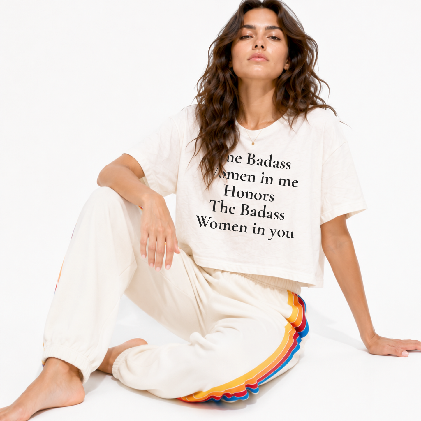 Close-up of “The Badass Woman in Me Honors the Badass Woman in You” printed on a women’s boxy crop T-shirt.