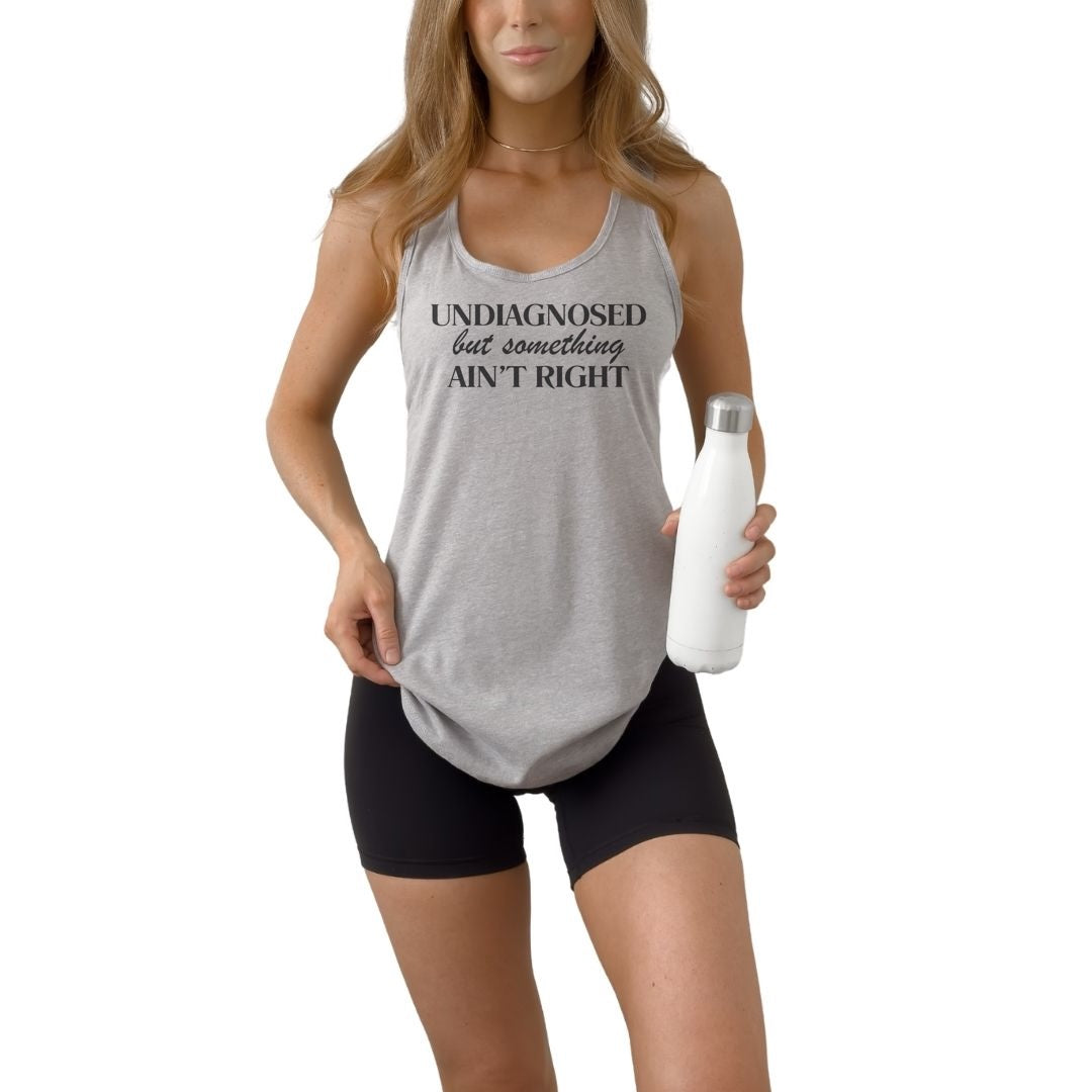 Undiagnosed but Something Ain’t Right women’s racerback tank top featuring bold sarcastic humor statement design.