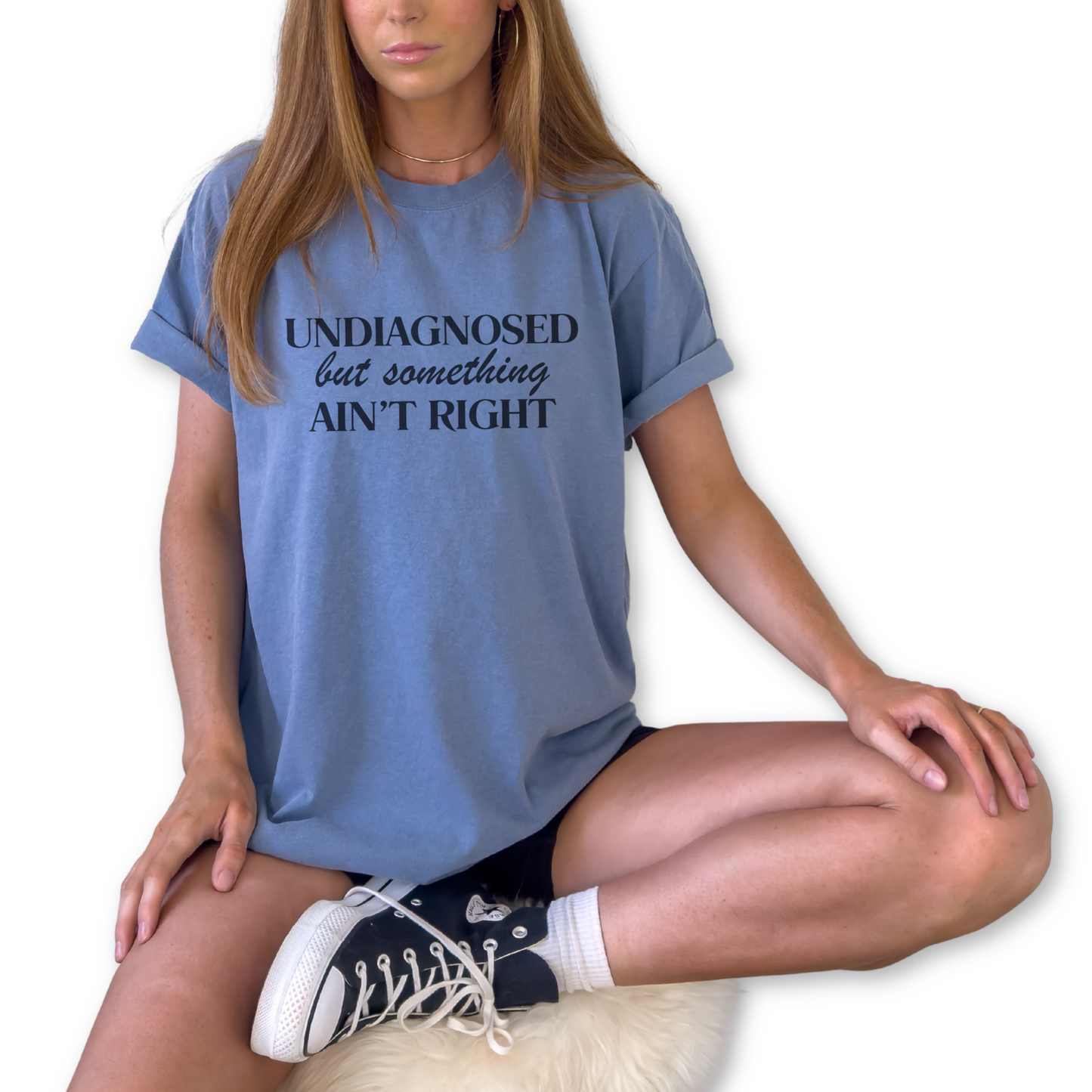 Funny Undiagnosed but Something Ain’t Right quote shirt on unisex tee.