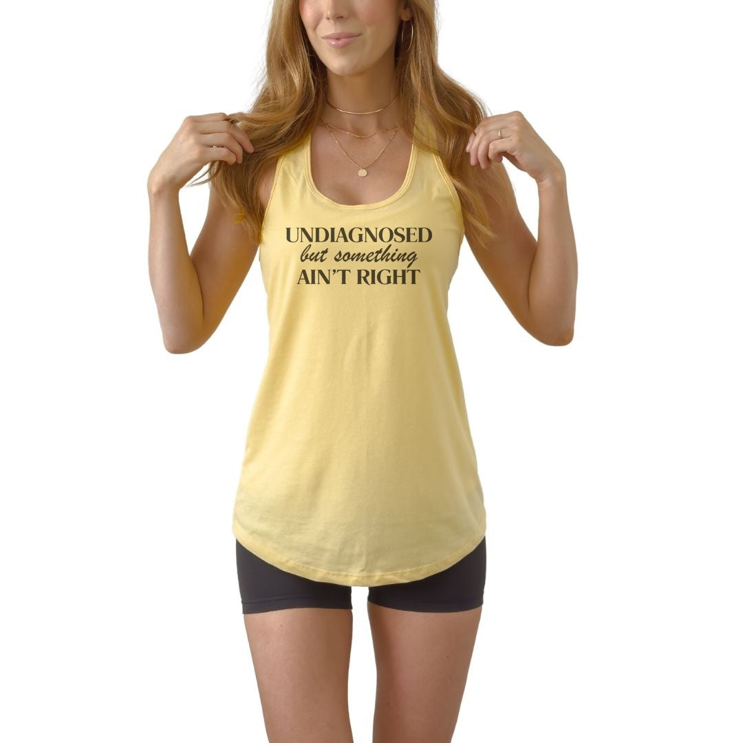 Undiagnosed but Something Ain’t Right women’s racerback tank top featuring bold sarcastic humor statement design.