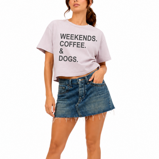Woman wearing the Weekends, Coffee & Dogs women's washed garment-dyed mid-length graphic t-shirt with a vintage-inspired look, perfect for dog lovers, coffee lovers, and everyday casual style.