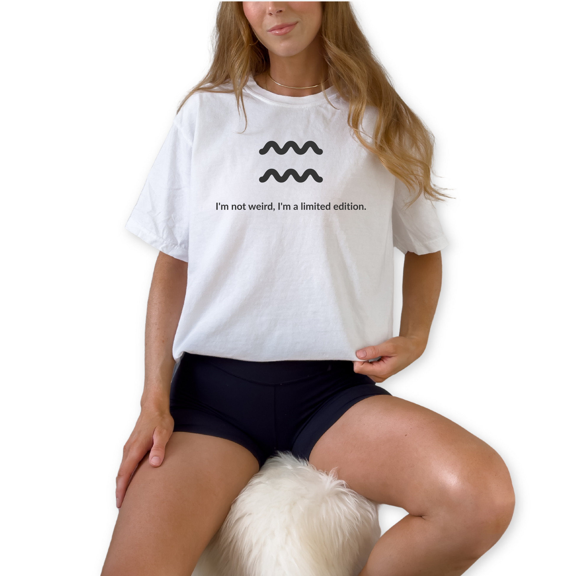 Aquarius zodiac graphic t-shirt featuring the quote "I'm not weird, I'm a limited edition." Astrology inspired unisex tee for Aquarius birthdays, horoscope lovers, and unique personality types.