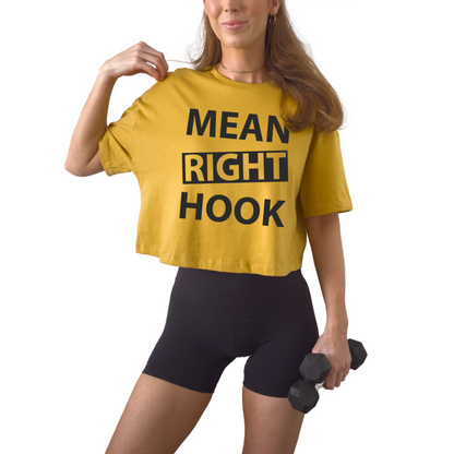 Women’s boxy cropped t-shirt featuring “Mean Right Hook” graphic design, trendy short-length tee with relaxed fit, perfect for streetwear outfits, bold fashion looks, and casual styling, soft breathable fabric ideal for everyday wear, modern cropped silhouette for confident style gym shirt