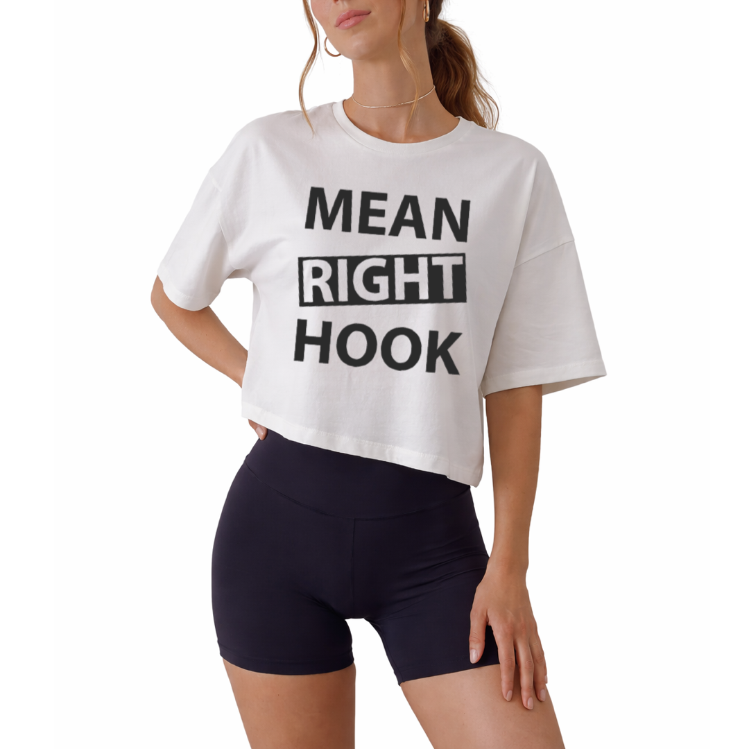 Women’s boxy cropped t-shirt featuring “Mean Right Hook” graphic design, trendy short-length tee with relaxed fit, perfect for streetwear outfits, bold fashion looks, and casual styling, soft breathable fabric ideal for everyday wear, modern cropped silhouette for confident style